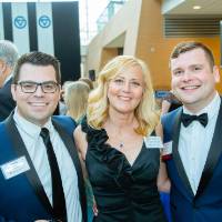 Justin Gray, Zach Baxter and guest at the Enrichment Dinner